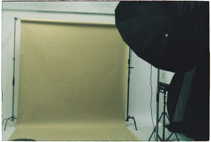 Two blank photo frames side by side on a neutral wall